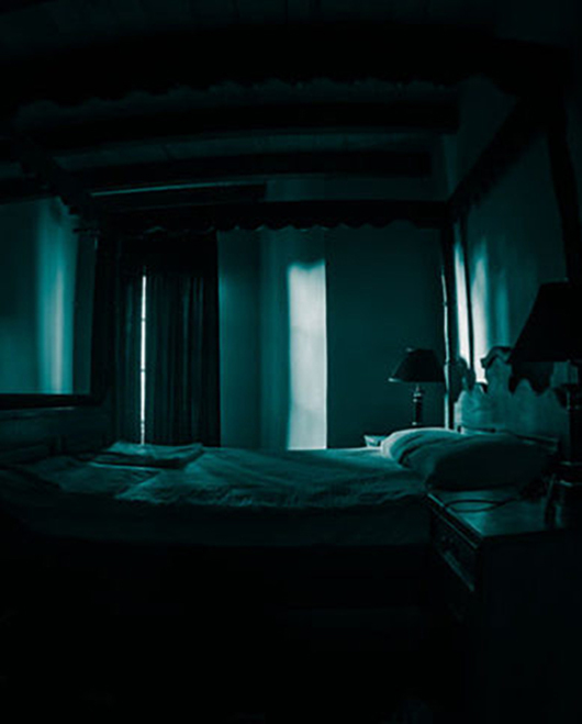 A creepy bedroom scenery, Antique scary bedroom with window and Halloween pumpkin. Horror Holiday concept