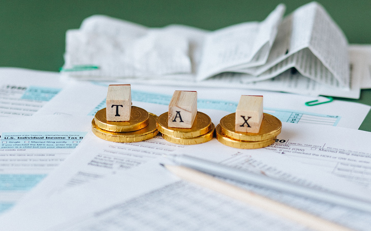 Tax Documents and money on a Table