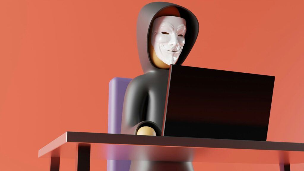 3D illustration of a person in a hacker mask using a laptop, symbolizing online threats, password breaches, and the importance of good cybersecurity habits.
